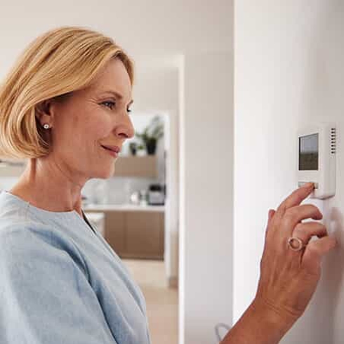 Lady turning on the AC